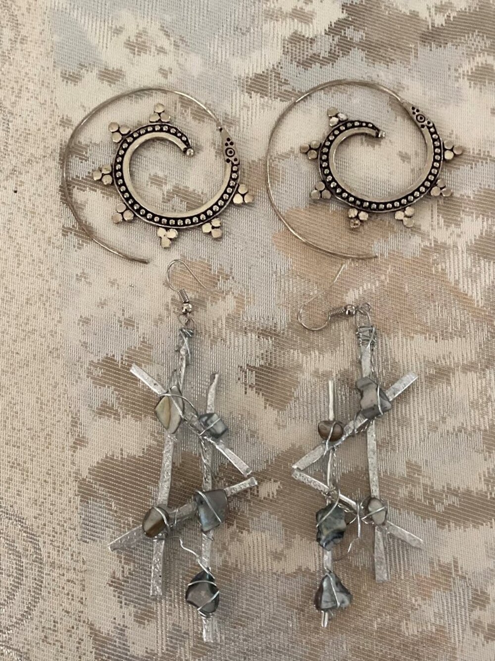 Two pairs of silver earrings-silver with blue stone chips and silver and black